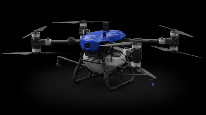 Revolution R-40 spray drone rotating against a black studio background